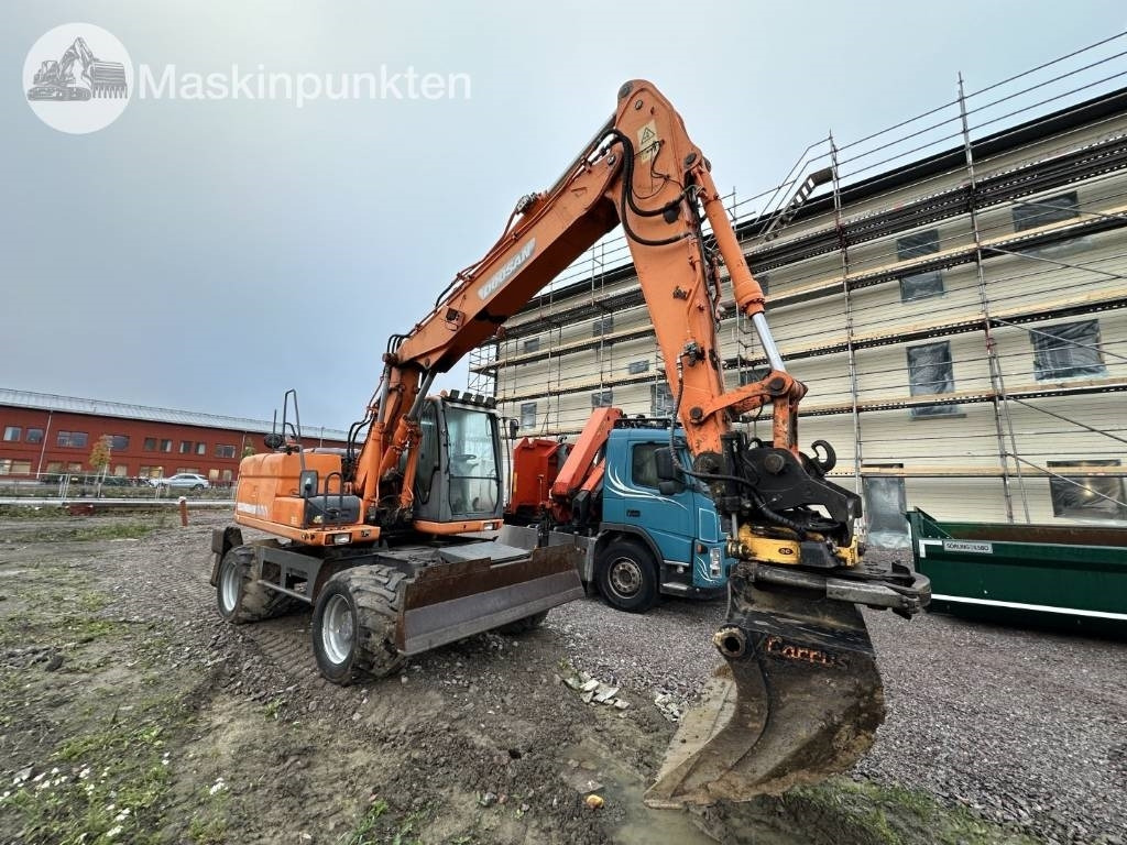 Doosan DX 140 W med vagn och redskap - מחפר גלגלים: תמונה 2 Doosan DX 140 W med vagn och redskap - מחפר גלגלים: תמונה 2