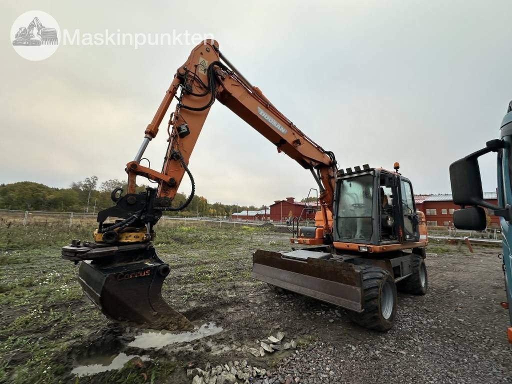 Doosan DX 140 W med vagn och redskap - מחפר גלגלים: תמונה 1 Doosan DX 140 W med vagn och redskap - מחפר גלגלים: תמונה 1
