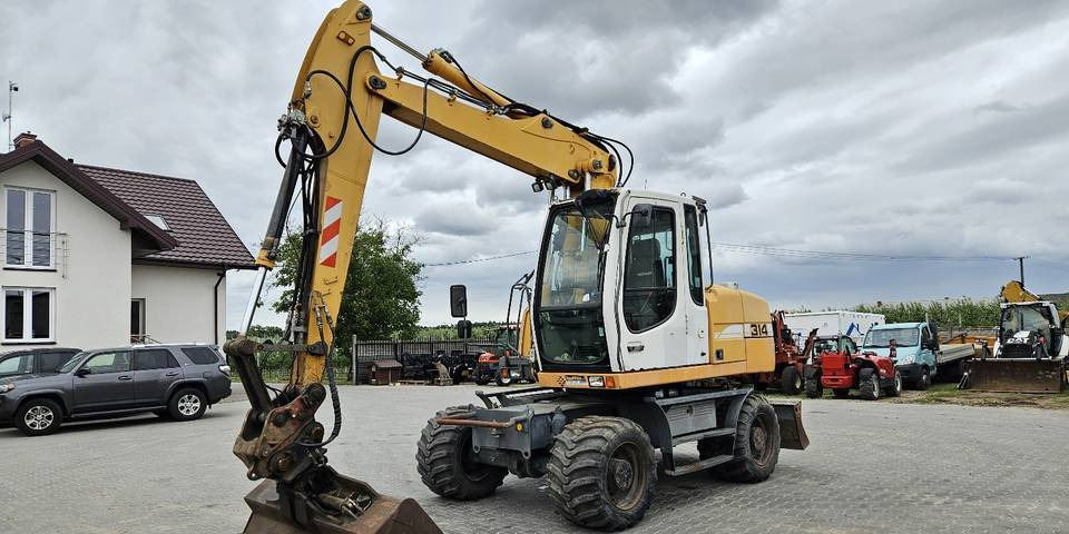 Koparka kołowa Liebherr A314 Litronic 9350 h 4 łyżki kołówka - מחפר גלגלים: תמונה 2 Koparka kołowa Liebherr A314 Litronic 9350 h 4 łyżki kołówka - מחפר גלגלים: תמונה 2