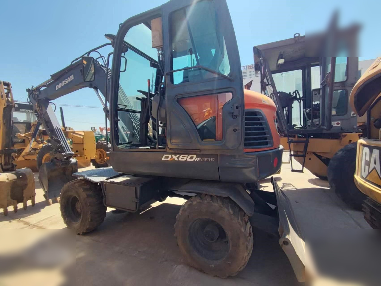 DOOSAN DX60W ECO - מחפר גלגלים: תמונה 1 DOOSAN DX60W ECO - מחפר גלגלים: תמונה 1