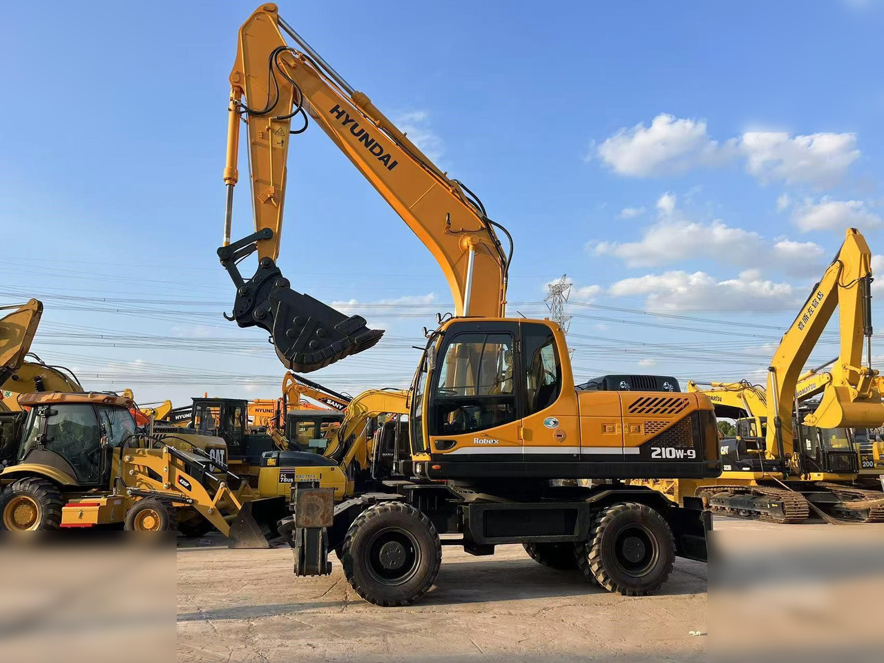 HYUNDAI ROBEX 210W-9 - מחפר גלגלים: תמונה 1 HYUNDAI ROBEX 210W-9 - מחפר גלגלים: תמונה 1
