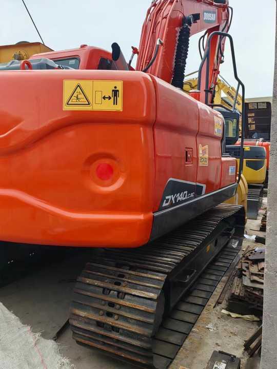 Used Digger DOOSAN DX140 Construction Machinery Construction Digger Used DOOSAN DX140 Cheap Excavator - מחפר סורק: תמונה 3 Used Digger DOOSAN DX140 Construction Machinery Construction Digger Used DOOSAN DX140 Cheap Excavator - מחפר סורק: תמונה 3