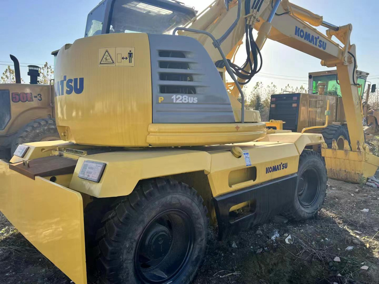 KOMATSU PC128US - מחפר גלגלים: תמונה 2 KOMATSU PC128US - מחפר גלגלים: תמונה 2