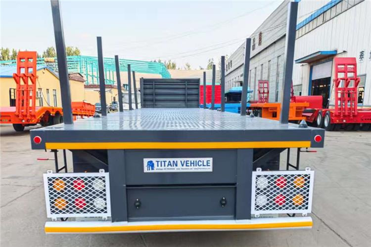 TITAN 3 Axle Flatbed Trailer Truck With Wooden Piles Price In Guma - סמיטריילר מוביל מכולות/ החלפת גוף: תמונה 3 TITAN 3 Axle Flatbed Trailer Truck With Wooden Piles Price In Guma - סמיטריילר מוביל מכולות/ החלפת גוף: תמונה 3