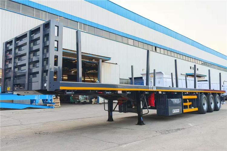 TITAN 3 Axle Flatbed Trailer Truck With Wooden Piles Price In Guma - סמיטריילר מוביל מכולות/ החלפת גוף: תמונה 2 TITAN 3 Axle Flatbed Trailer Truck With Wooden Piles Price In Guma - סמיטריילר מוביל מכולות/ החלפת גוף: תמונה 2
