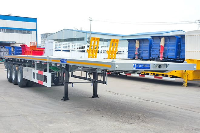 TITAN Tri Axle 40Ft Flatbed Trailer Price for Sale in Sierra Leone - סמיטריילר צד נופל/ שטוח: תמונה 1 TITAN Tri Axle 40Ft Flatbed Trailer Price for Sale in Sierra Leone - סמיטריילר צד נופל/ שטוח: תמונה 1