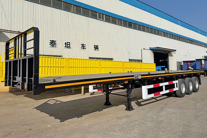 TITAN Tri Axle Flatbed Trailer for Sale in Jamaica - סמיטריילר צד נופל/ שטוח: תמונה 1 TITAN Tri Axle Flatbed Trailer for Sale in Jamaica - סמיטריילר צד נופל/ שטוח: תמונה 1