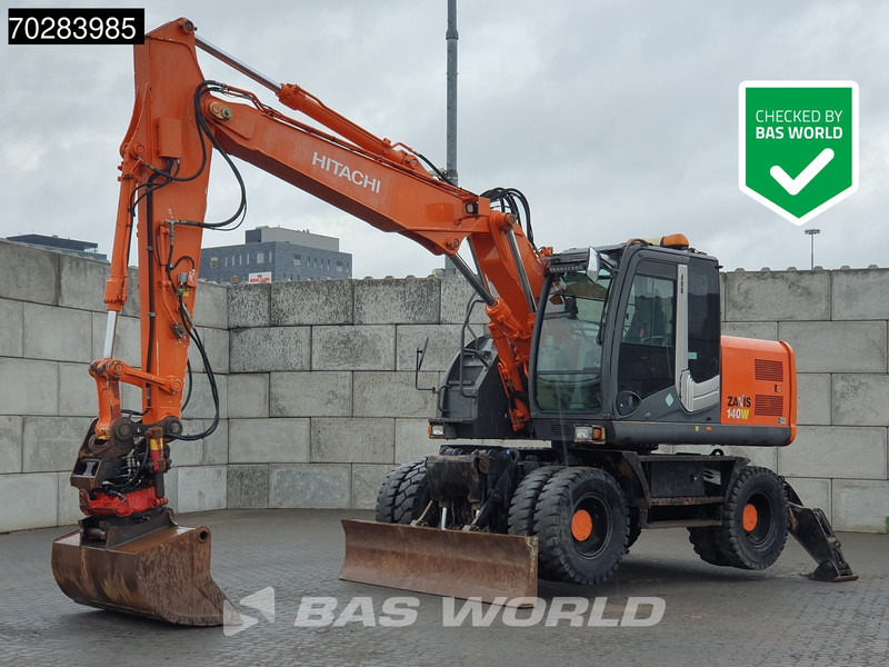 Hitachi ZX140W -3 OUTRIGGERS - ROTOTILT - מחפר גלגלים: תמונה 1 Hitachi ZX140W -3 OUTRIGGERS - ROTOTILT - מחפר גלגלים: תמונה 1