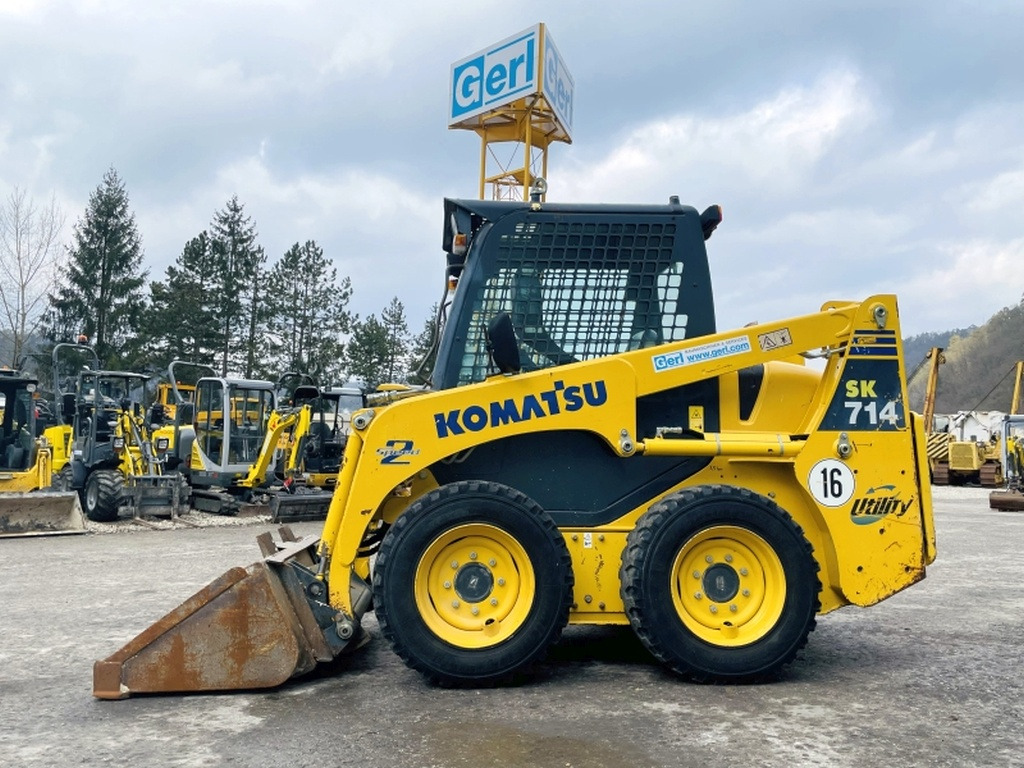 Komatsu SK714-5 (3947) - מעמיס היגוי החלקה: תמונה 1 Komatsu SK714-5 (3947) - מעמיס היגוי החלקה: תמונה 1