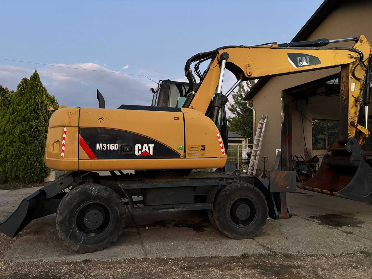 Caterpillar M316D - מחפר גלגלים: תמונה 1 Caterpillar M316D - מחפר גלגלים: תמונה 1