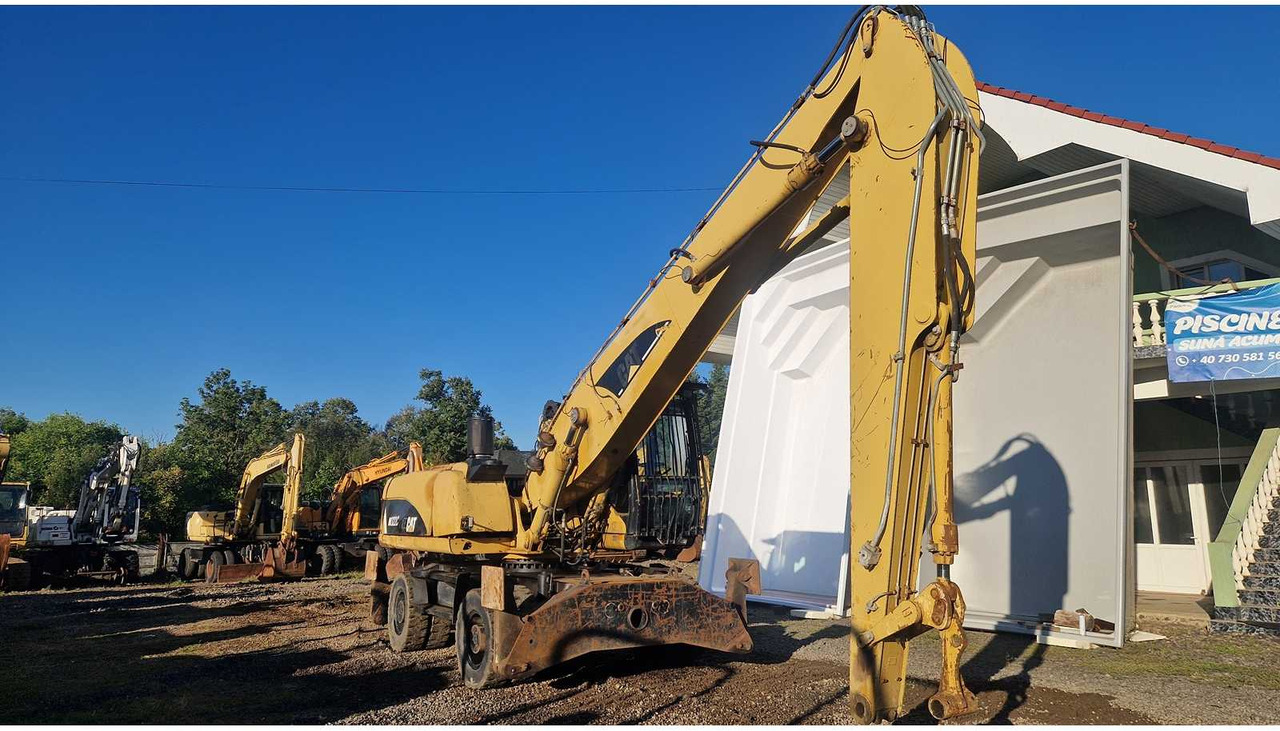 Caterpillar M322C - מחפר גלגלים: תמונה 4 Caterpillar M322C - מחפר גלגלים: תמונה 4