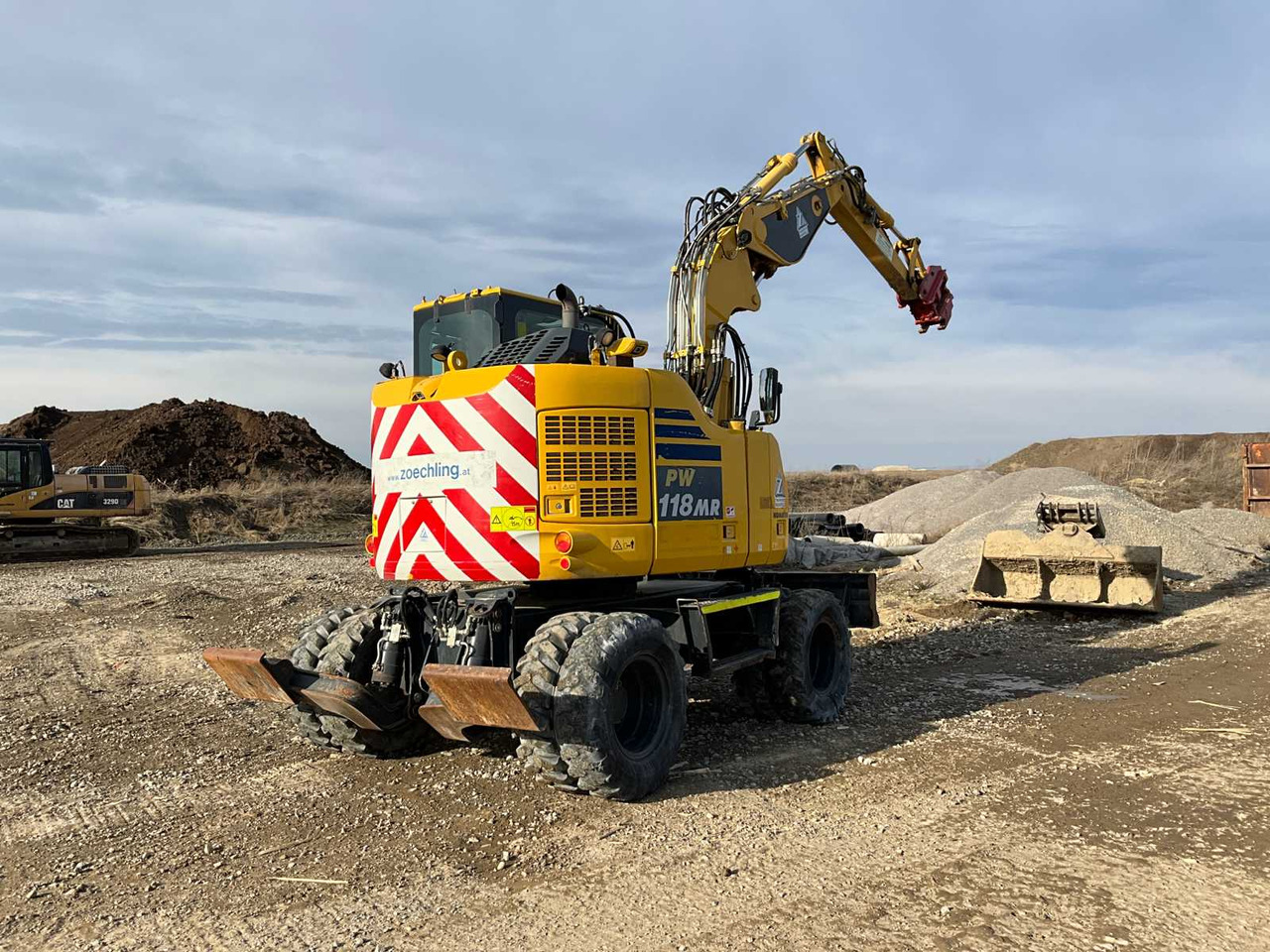 Komatsu PW118MR-11 - מחפר גלגלים: תמונה 1 Komatsu PW118MR-11 - מחפר גלגלים: תמונה 1