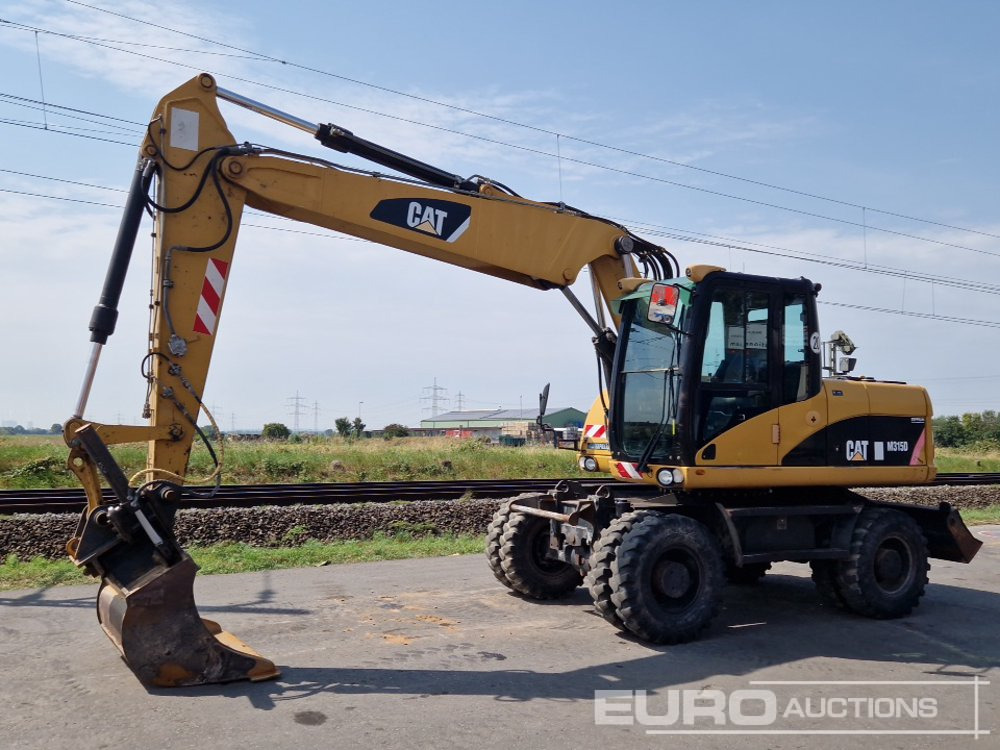 CAT M315D - מחפר גלגלים: תמונה 1 CAT M315D - מחפר גלגלים: תמונה 1