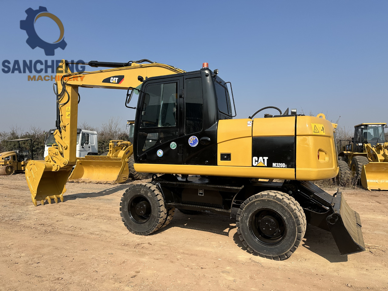 CATERPILLAR M320D2 - מחפר גלגלים: תמונה 1 CATERPILLAR M320D2 - מחפר גלגלים: תמונה 1