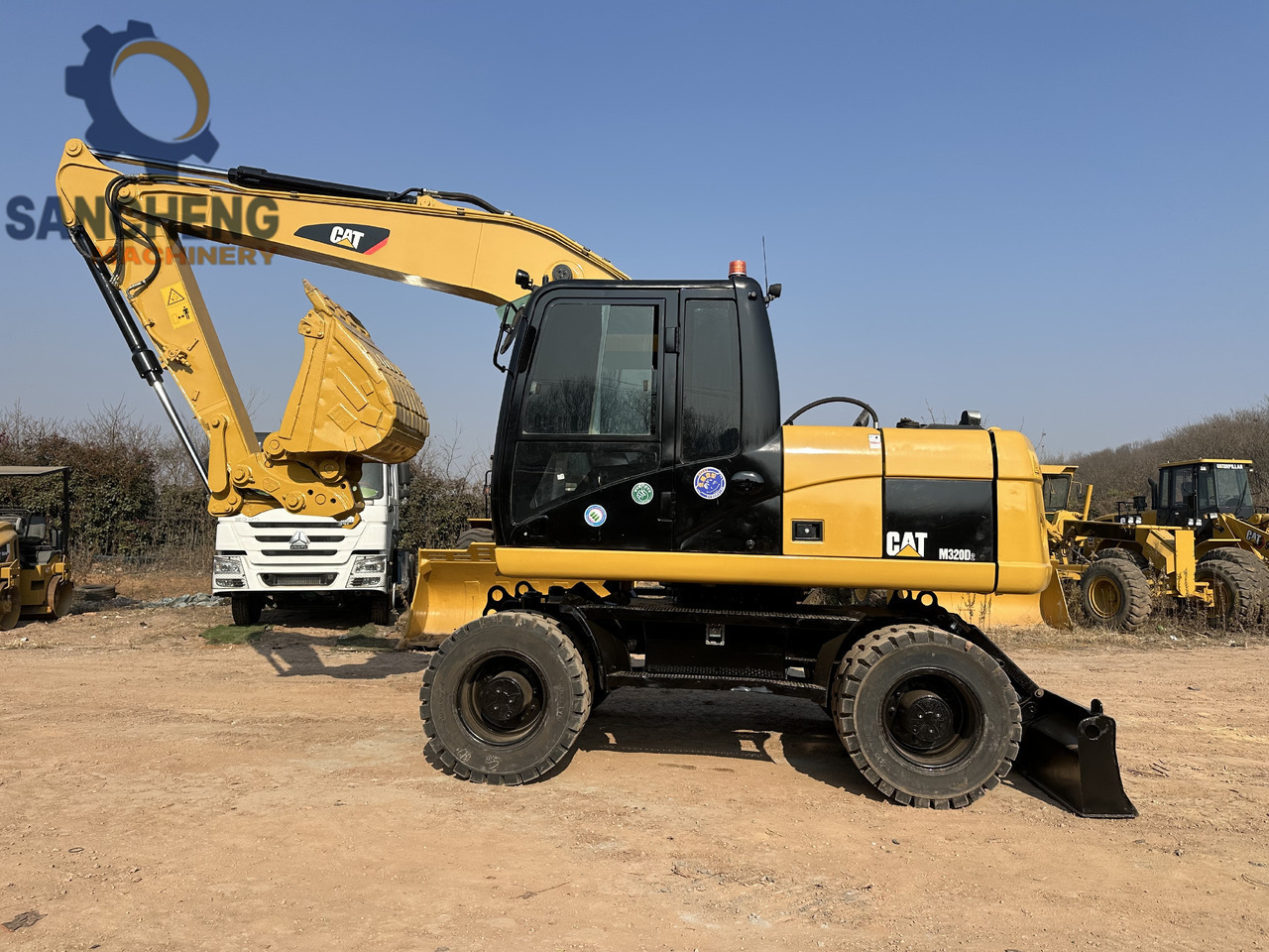 CATERPILLAR M320D2 - מחפר גלגלים: תמונה 1 CATERPILLAR M320D2 - מחפר גלגלים: תמונה 1