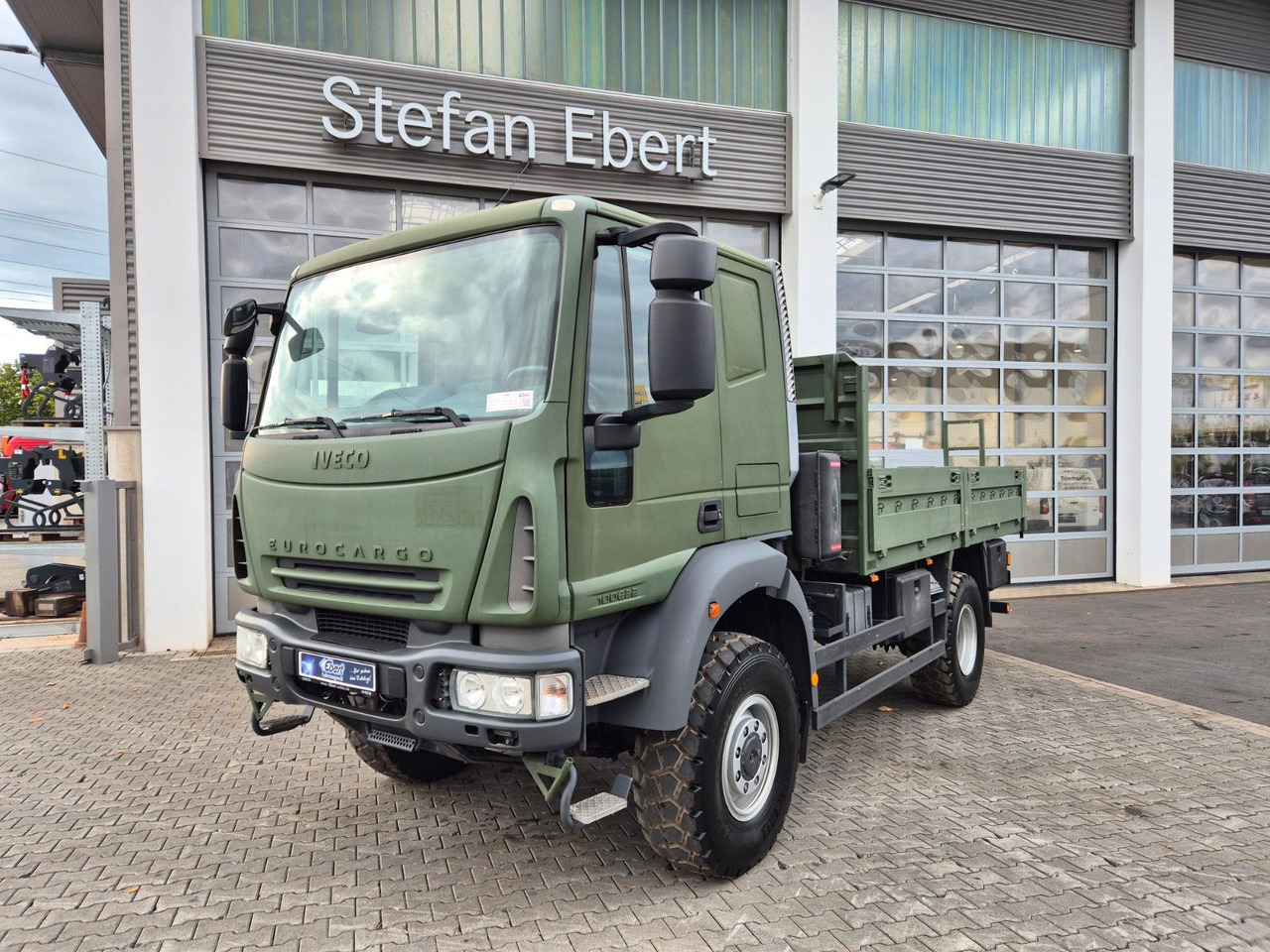 Iveco Eurocargo ML100E22WM-BW 4x4 Pritsche L-Haus Bett - משאית צד נופל/ שטוחה: תמונה 1 Iveco Eurocargo ML100E22WM-BW 4x4 Pritsche L-Haus Bett - משאית צד נופל/ שטוחה: תמונה 1