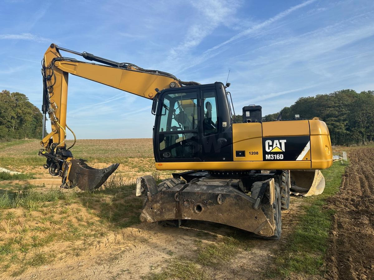 Caterpillar M 316D - מחפר גלגלים: תמונה 1 Caterpillar M 316D - מחפר גלגלים: תמונה 1
