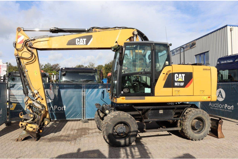 Caterpillar M318F - מחפר גלגלים: תמונה 1 Caterpillar M318F - מחפר גלגלים: תמונה 1