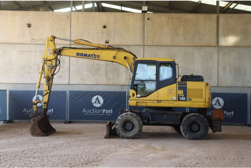Komatsu PW140-7 - מחפר גלגלים: תמונה 2 Komatsu PW140-7 - מחפר גלגלים: תמונה 2