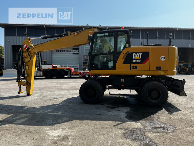 Cat M318F - מחפר גלגלים: תמונה 1 Cat M318F - מחפר גלגלים: תמונה 1